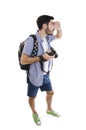 Summer holidays and tourism concept. Handsome man with backpack and camera