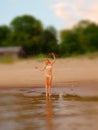 Summer holidays, vacation and beach concept - blonde girl in white bikini posing on the beach. Background blur Royalty Free Stock Photo