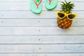 Summer holidays vacation concept,pineapple watermelon on wooden background with copy space