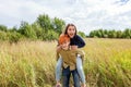 Summer holidays vacation happy people concept. Loving couple having fun in nature outdoors. Happy young man piggybacking his Royalty Free Stock Photo