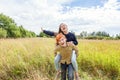 Summer holidays vacation happy people concept. Loving couple having fun in nature outdoors. Happy young man piggybacking his Royalty Free Stock Photo