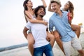 Group of friends having fun on the beach. Summer holidays, vacation and people concept. Royalty Free Stock Photo