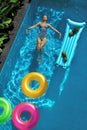Summer Holidays. Woman Enjoying Vacation, Floating In Swimming Pool Royalty Free Stock Photo