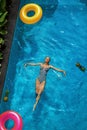 Summer Holidays. Woman Enjoying Vacation, Floating In Swimming Pool Royalty Free Stock Photo