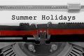 Summer Holydays text on white sheet in vintage typewriter Royalty Free Stock Photo