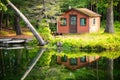 Summer home cabin in the woods at the lake Royalty Free Stock Photo