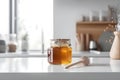 Summer honey jar on table in white kitchen with scandinavian design