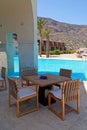 Summer hotel terrace with pool and outdoor furniture(Greece) Royalty Free Stock Photo