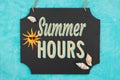 Summer Hours hanging chalkboard sign with seashells Royalty Free Stock Photo