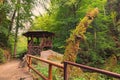 Summer house for tourists in green forest. Hiking trail near flowing Kamenice river in Bohemian Switzerland National Park. Royalty Free Stock Photo