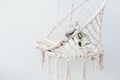 Summer hygge concept with hammock chair in the garden