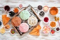 Summer ice cream bar top view table scene on a rustic white wood background