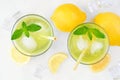 Summer iced green tea, top view over white marble