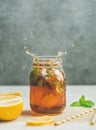 Summer Iced tea with lemon and herbs, copy space Royalty Free Stock Photo