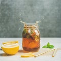 Summer Iced tea with lemon and herbs, square crop Royalty Free Stock Photo