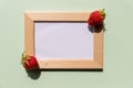 Summer information board,wooden frame on green background with red cherries berries fruits in corner, fresh berry Royalty Free Stock Photo