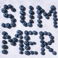 Summer inscription lined from blueberries. Fruits and berries, vegetarian and healthy eating concept. Summer text