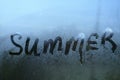 Summer inscription on the texture with condensation on the glass.