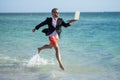 summer inspiration for business man. Beach for the director businessman. Businessman director running at beach. director Royalty Free Stock Photo