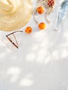 Summer inspired background with straw hat, female sunglasses and reusable shopper bag with fruits. Royalty Free Stock Photo