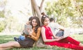 Group of students or teenagers with laptop and tablet computers hanging out Royalty Free Stock Photo