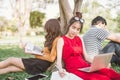 Group of students or teenagers with laptop and tablet computers hanging out Royalty Free Stock Photo