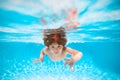 Summer kids in sea water on beach. Kid swimming in pool underwater. Child boy swim under water in sea. Royalty Free Stock Photo