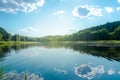 Summer lake landscape with beautiful blue sky, green forest and sunlight. Reflection of the bright sky in the lake Royalty Free Stock Photo