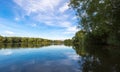 Summer lake landscape with green trees and bush, Woking, Surrey