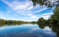 Summer lake landscape with green trees and bush, Woking, Surrey