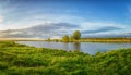 Summer landscape on the banks of the green river at sunset, Russia, Royalty Free Stock Photo