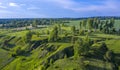 Summer landscape with a bird`s eye view, fields, ravines and birch trunks Royalty Free Stock Photo