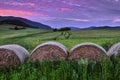 Summer Landscape at dusk with old bales of straw.