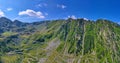 Summer landscape in Fagaras mountains, green crest and mountain road Royalty Free Stock Photo