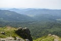 Summer landscape with forested hills and clouds in the sky above the valley. Carpathian mountains, Ukraine Royalty Free Stock Photo