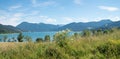 summer landscape Kaltenbrunn with flower meadow, view to lake Tegernsee and bavarian alps Royalty Free Stock Photo