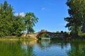 Summer landscape with lake and bridge in Gatchina park, Royalty Free Stock Photo