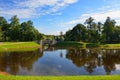 Summer landscape with lake and bridge in Gatchina park, Royalty Free Stock Photo