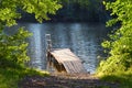 Wooden bridge near the lake, in nature, park, platform, stream, river, summer landscape, sunny day Royalty Free Stock Photo