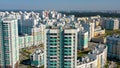 Summer landscape of a new city district on a summer sunny day. Video. Aerial view of newly built high rise residential