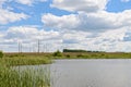 landscape with a power line across the lake Royalty Free Stock Photo