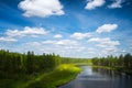 Summer landscape with river cloudy sky forest and sun Royalty Free Stock Photo