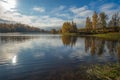 Wonderful picturesque Scene. Awesome Autumn landscape with colorful sky, reflected on the calm river. Amazing nature counryside. I