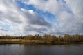 Summer landscape with river cloudy sky forest and sun Royalty Free Stock Photo