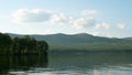 Summer landscape with river, cloudy sky, forest and sun timelapse. summer landscape with river and blue sky time lapse Royalty Free Stock Photo