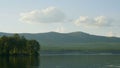 Summer landscape with river, cloudy sky, forest and sun timelapse. summer landscape with river and blue sky time lapse Royalty Free Stock Photo