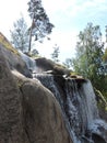 Beautiful landscape with pine tree, rocks, waterfall in Kotka, Finland Royalty Free Stock Photo