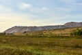 Summer landscape on the salt mountains against the blue sky. Mining industry. Extraction of silica from the ground near the city