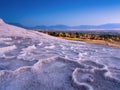 Summer landscape during sunset. The view of the travertines and the bright sunset. Pamukkale, Turkey Royalty Free Stock Photo