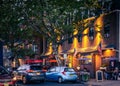 Summer landscape view of people enjoying the nightlight of Piermont Avenue\'s restaurants, shops